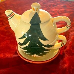 Vintage Barnes & Noble teapot on top of cup and saucer